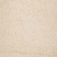 A soft sandstone with a light, creamy beige color and small speckles.