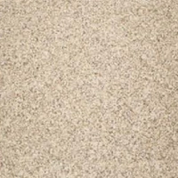 Close-up of a speckled, beige stone surface.