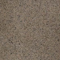 Close-up of a grainy, soft stone surface with brown and gray speckles.