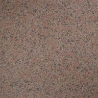 Close-up of a speckled stone surface in pink, gray, and black.