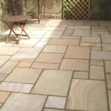 A patio with a table and chairs